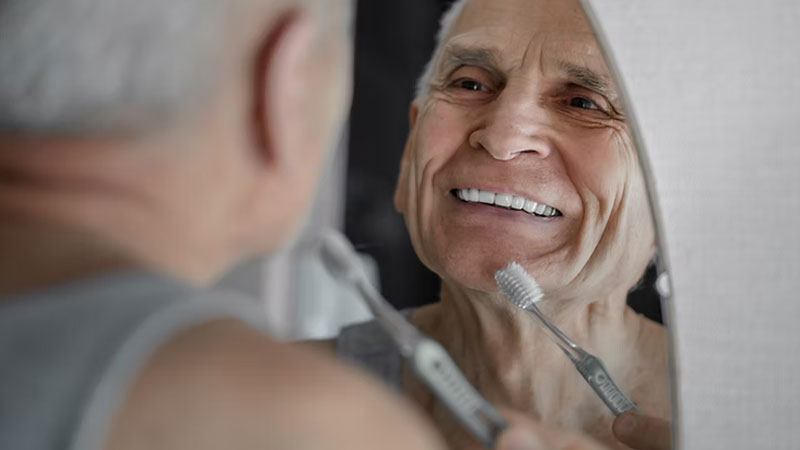 Elderly Person Brushing Teeth